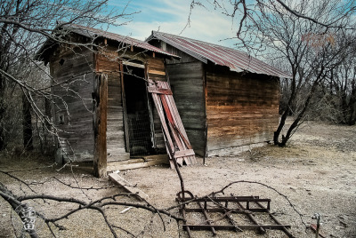 Storage Shed And Outhouse Wooden storage shed and attached outhouse.