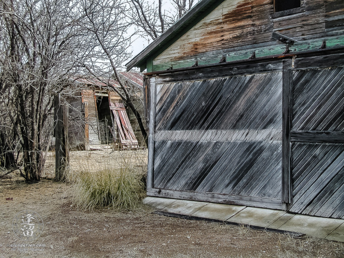 Old green wooden barn at ghost town of Fairbank, Arizona.