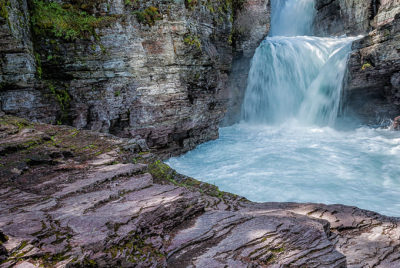 St. Mary's Falls 2 Clear turquoise waters of St. Mary's Falls roaring through a gorge.