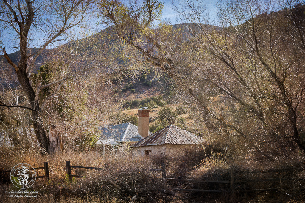 Brown Canyon Ranch framed by bare trees on a sunny Winter day.