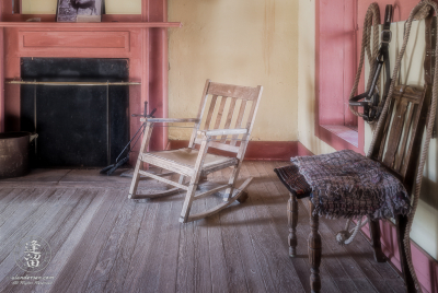 The Rocking Chair Rocking chair nestled between fireplace and window.