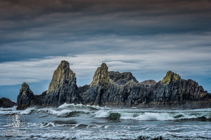 Morning Sun paints tips of jagged rock formations at Seal Rock State Wayside in Oregon.