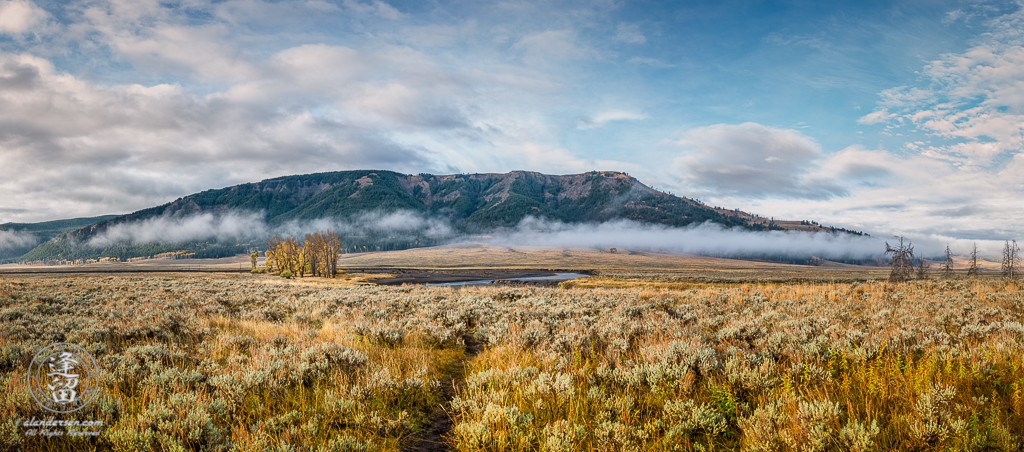 Clouds hanging low in Yellowstone National Park's Lamar Vally on a sunny but cold Autumn morning.
