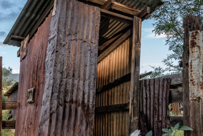 Brown Canyon Ranch Outhouse 5 Leaning outhouse made of corrugated tin by Brown Canyon Ranch corrals outside Sierra Vista in Arizona.