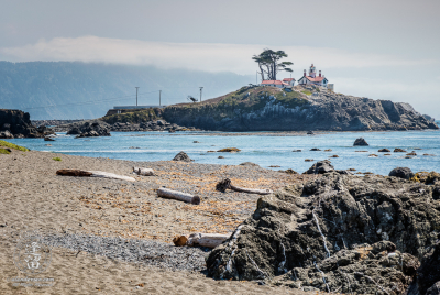 Battery Point Lighthouse And Beach Battery Point Lighthouse seen from road-side beach at Crescent City in Northern California.