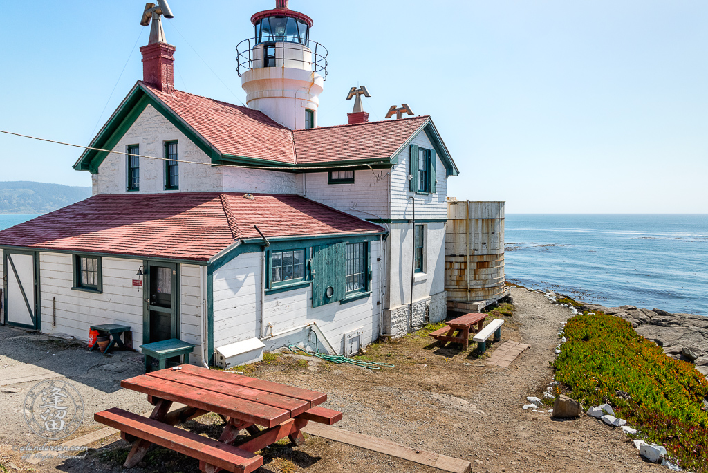 A side and rear view of the Battery Point Lighthouse, sitting atop a hill at Crescent City in Northern California.