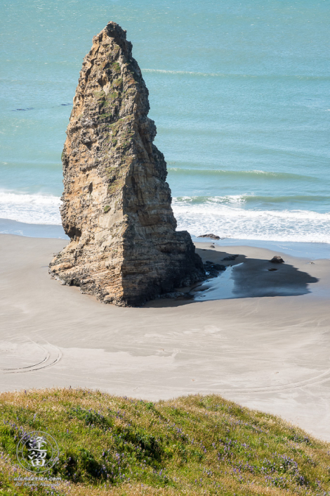 A solitary sea stack jutting up from the beach at Cape Blanco State Park outside of Port Orford in Oregon.