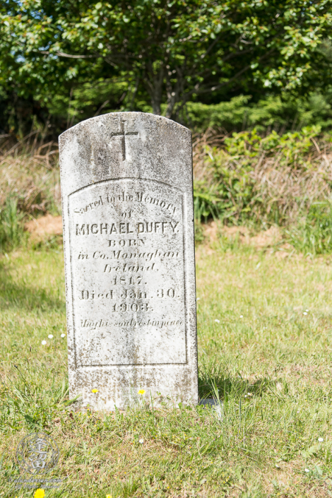 The tombstone for Michael Duffy in the Cape Blanco Pioneer Cemetery at Cape Blanco State Park, outside of Port Orford in Oregon.