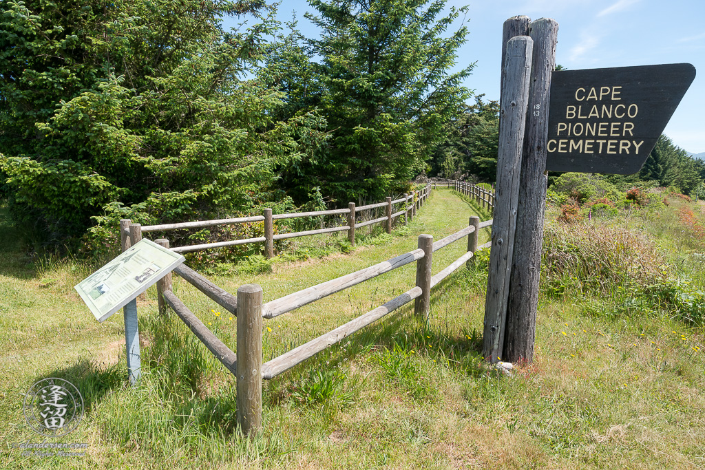 Fenced footpath leading to the Cape Blanco Pioneer Cemetery outside of Port Orford in Oregon.