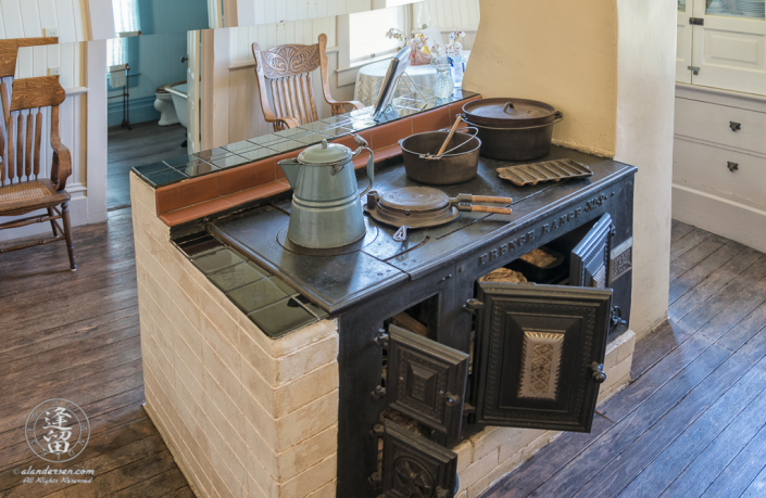 Iron free-standing stove in kitchen of Hughes Historic House near Port Orford, Oregon.