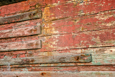 Peeling Paint On Abandoned Boat 2 An old rusted and rotted boat in dry dock on Starfish Way, by the Marina at Crescent City in Northern California.