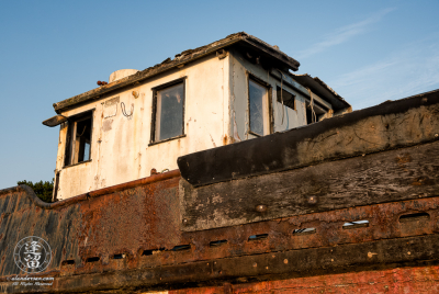 Abandoned Boat An old rusted and rotted boat in dry dock on Starfish Way, by the Marina at Crescent City in Northern California.