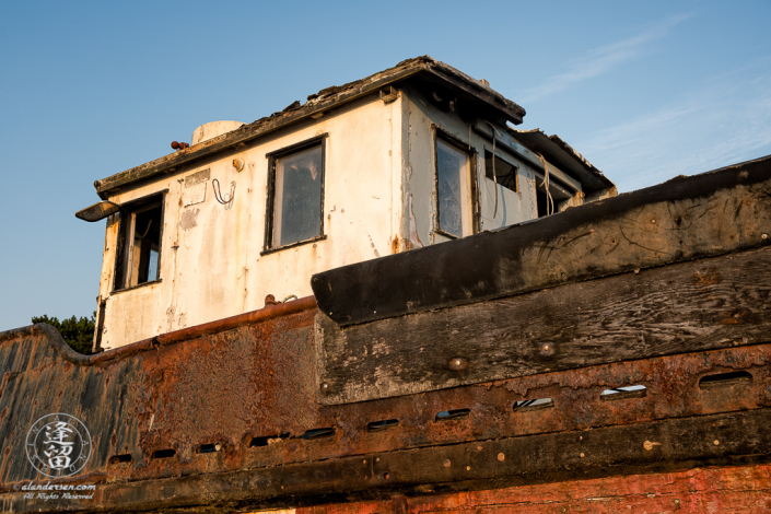 An old rusted and rotted boat in dry dock on Starfish Way, by the Marina at Crescent City in Northern California.
