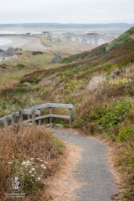 Stairs leading down to the beach at the north end of Kronenberg County Park near the 8th St SW parking area in Bandon, Oregon.