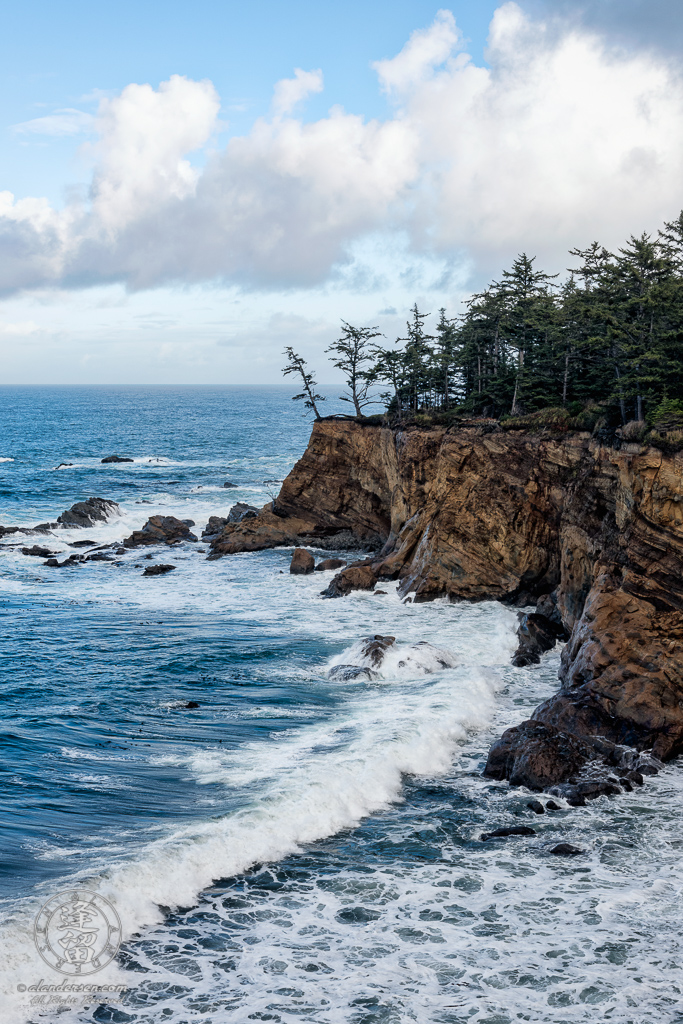 A view of the cliffs along the trail between Shore Acres State Park and the Simpson Reef Overlook, outside of Charleston in Oregon.