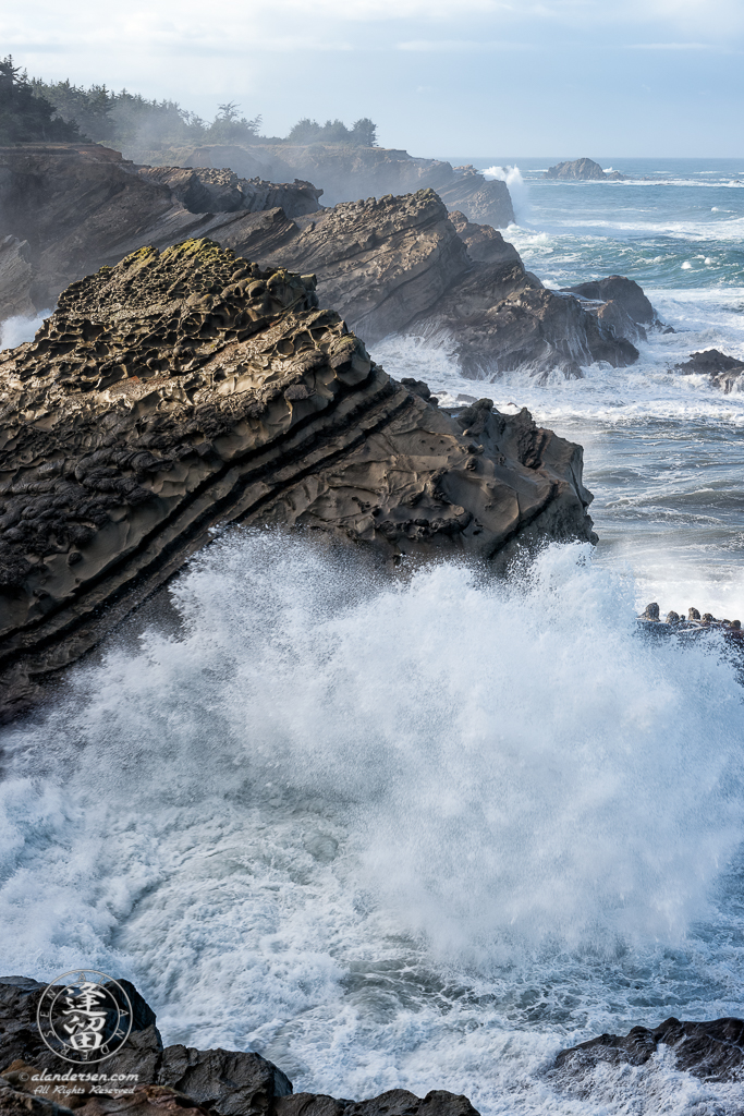 Pacific swells pound the rugged coast at Shore Acres State Park outside of Charleston in Oregon