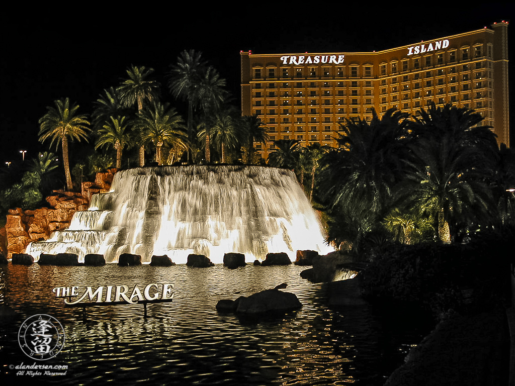 Treasure Island Casino lit up at night.