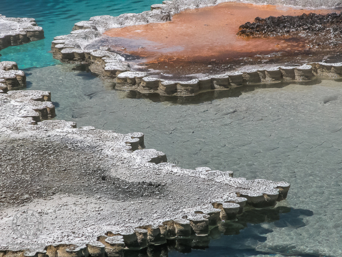 Abstract image gyserite edging around Doublet Pool in Yellowstone National Park.