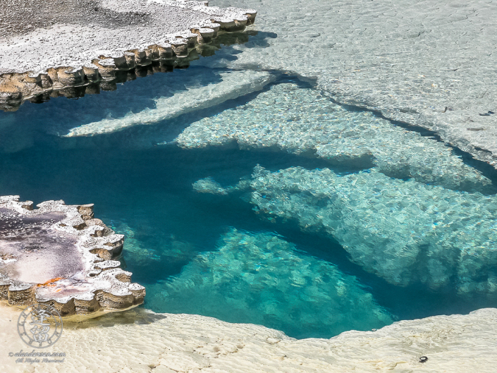 Abstract image gyserite edging around Doublet Pool in Yellowstone National Park.