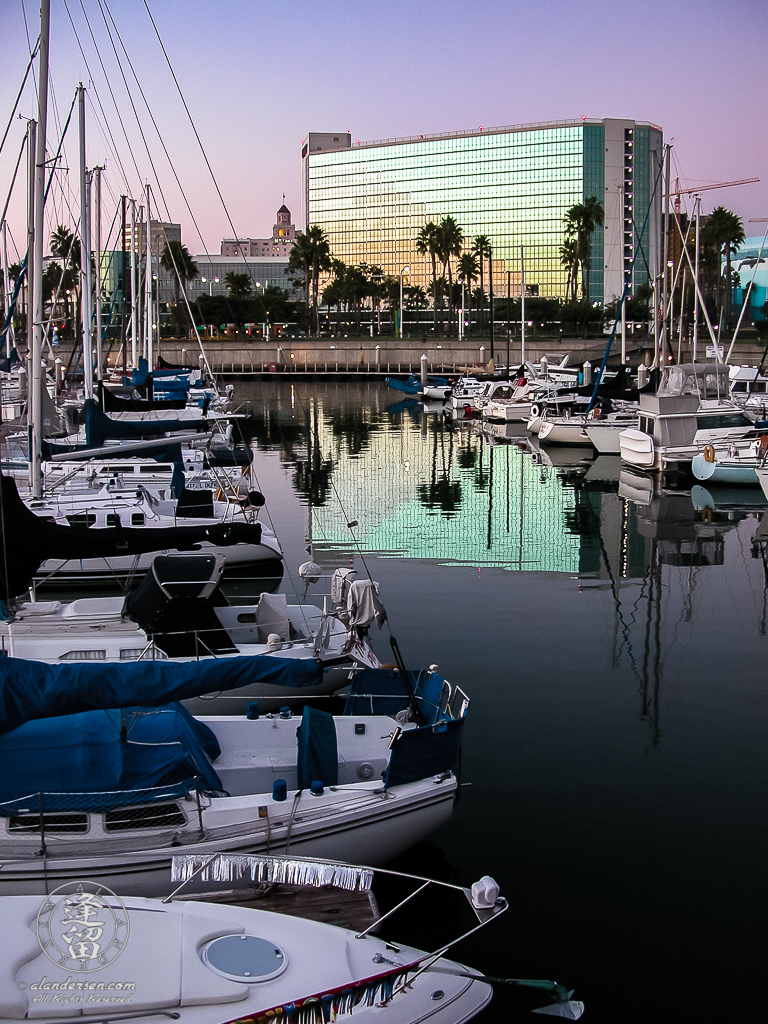 Hyatt Regency reflected in Shoreline Village Marina waters.