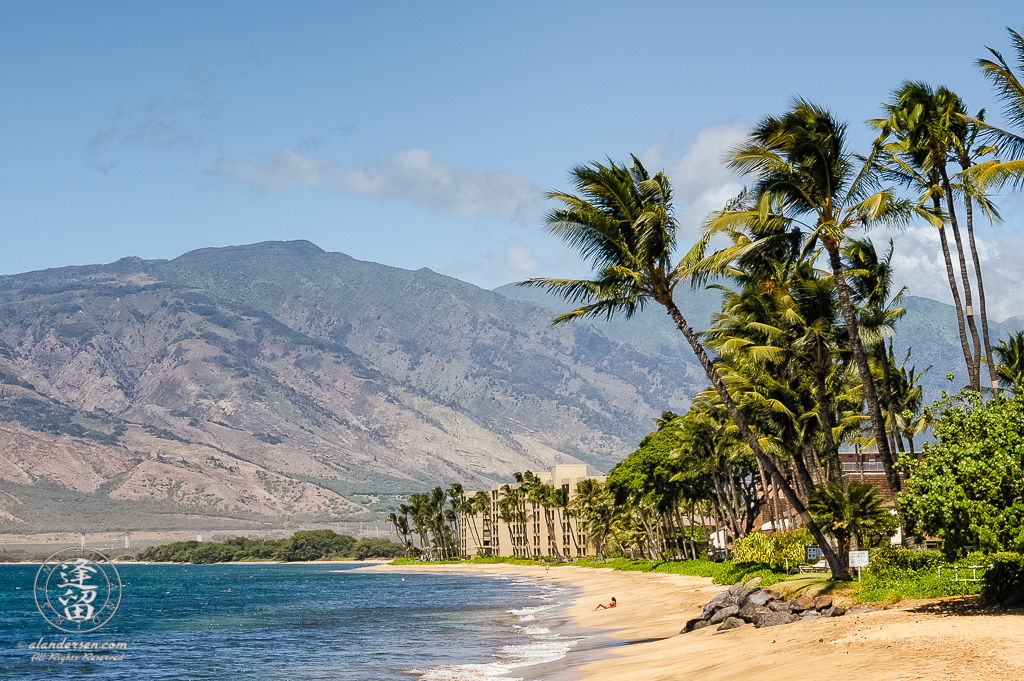 Lone bikini-clad sun worshipper laying on Kalaepohaku Beach.