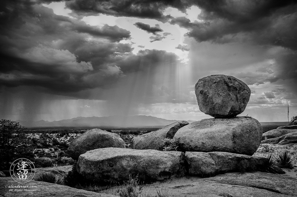 Summer Monsoon rainstorm sweeping across a desert valley.