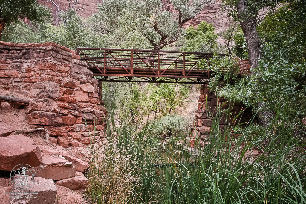 Brick foot bridge spanning creek below Weeping Rock at Zion National Park in Utah.