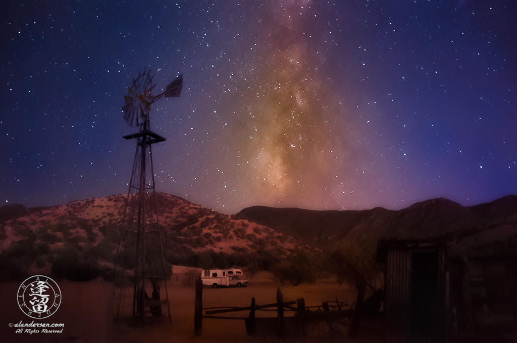 Milky Way rising into dark purple evening sky.