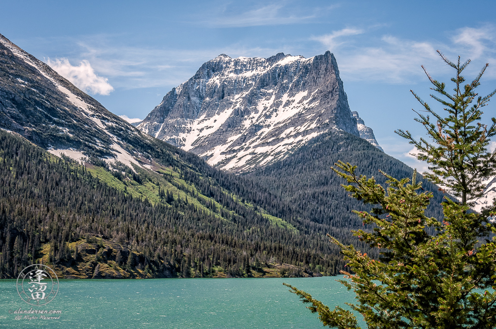 Mount Dusty Star rising majestically by Saint Mary's lake.