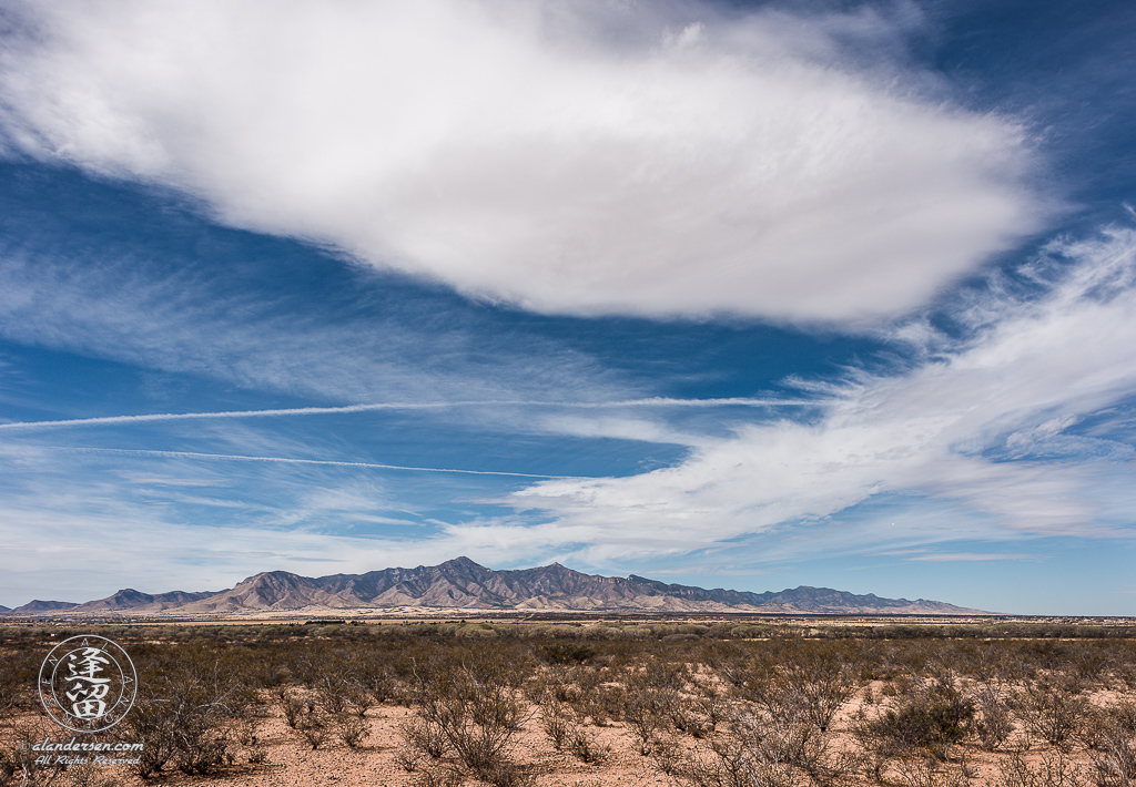 Cirrus clouds streaming above Arizona's Huachuca Mountains.