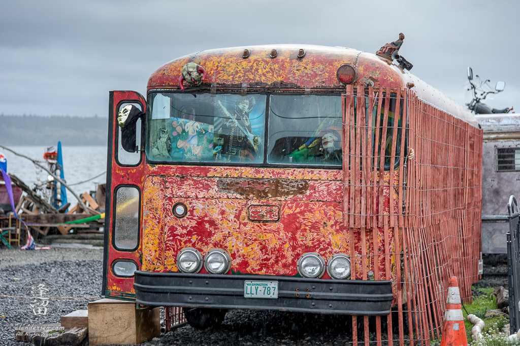 Rusted old bus parked at the dock end of Adams Street in Port Townsend, Washington, where the Adams Street Park is now.