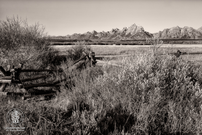 Grand Tetons behind the split-rail fence at Cunningham Cabin in Wyoming's Grand Teton National Park.