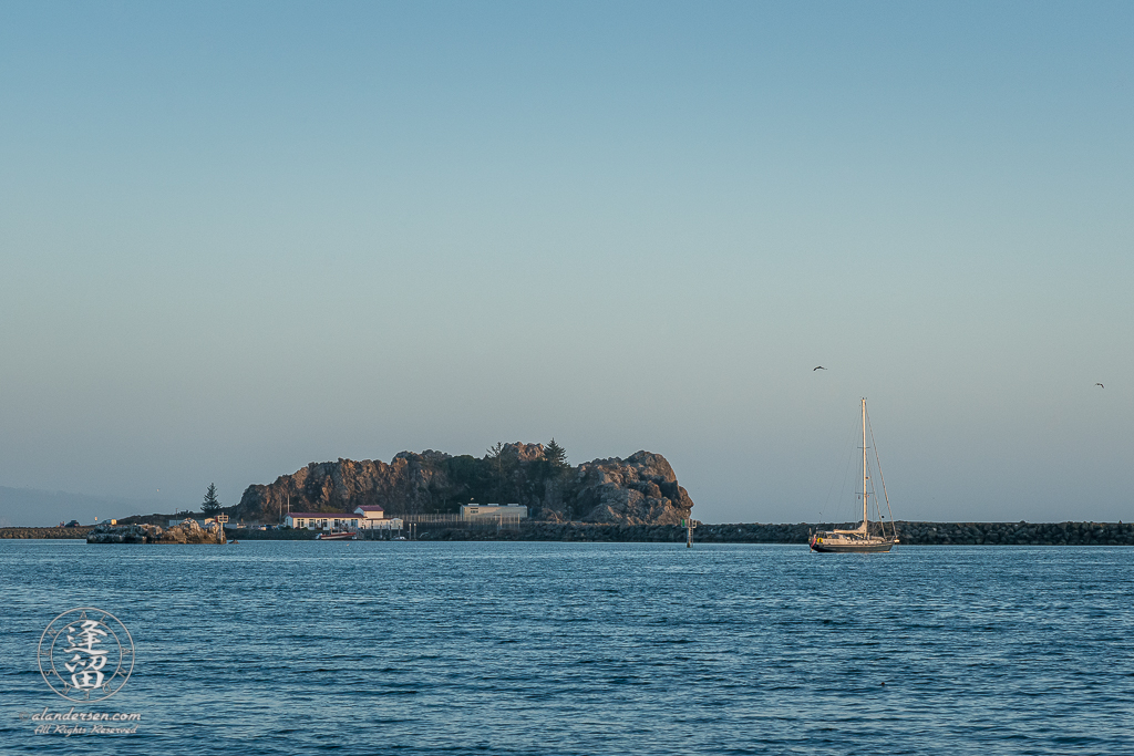 Sailboat Kahia lies idle near Whaler Island at Crescent City Bay in Northern California.