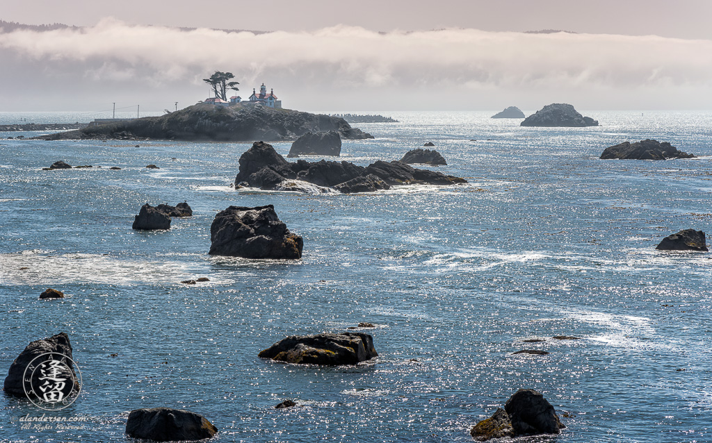 High-contrast view of Battery Point Lighthouse at Crescent City Bay in Northern California.