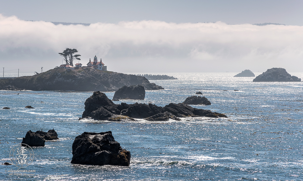 High-contrast view of Battery Point Lighthouse at Crescent City Bay in Northern California.