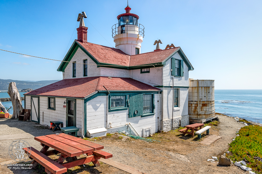 Side and rear view of Battery Point Lighthouse sitting atop hill at Crescent City in Northern California.