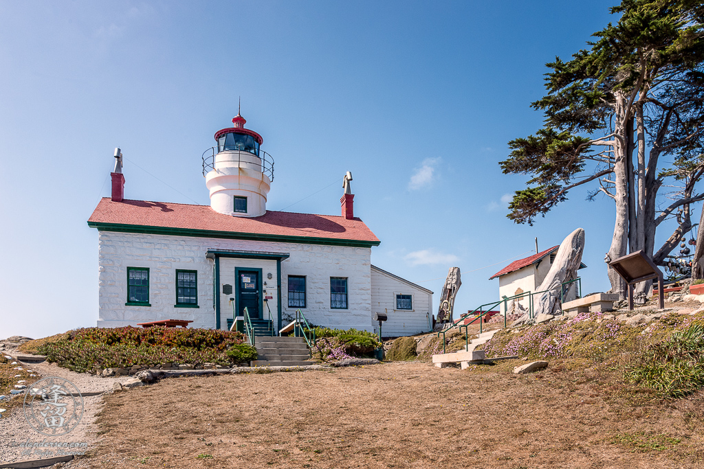 Front view of Battery Point Lighthouse sitting atop hill at Crescent City in Northern California.