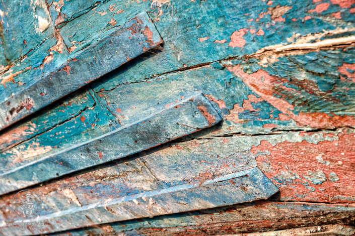 An old rusted and rotted boat in dry dock on Starfish Way, by the Marina at Crescent City in Northern California.