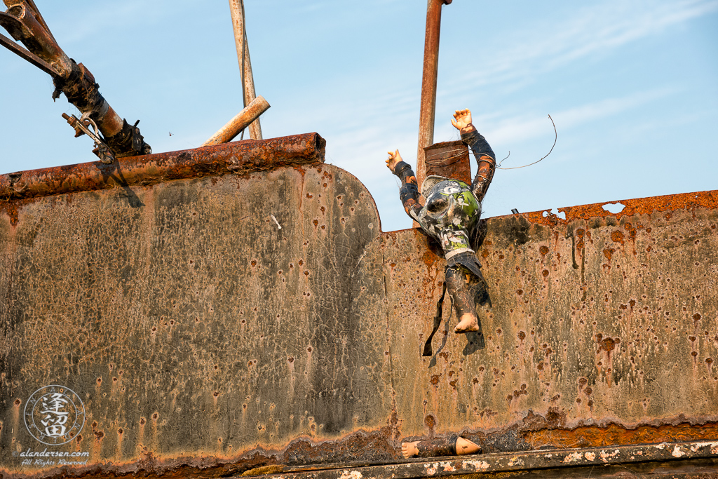 An old rusted and rotted boat in dry dock on Starfish Way, by the Marina at Crescent City in Northern California.