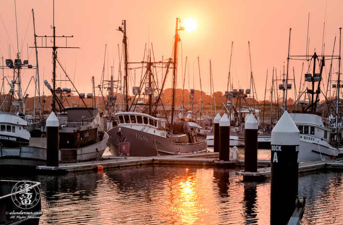 Smoke from Oregon wildfires turn the sky orange during a sunset at the Crescent City Marina in Northern California.