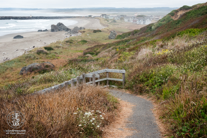 Stairs leading down to the beach at the north end of Kronenberg County Park near the 8th St SW parking area in Bandon, Oregon.