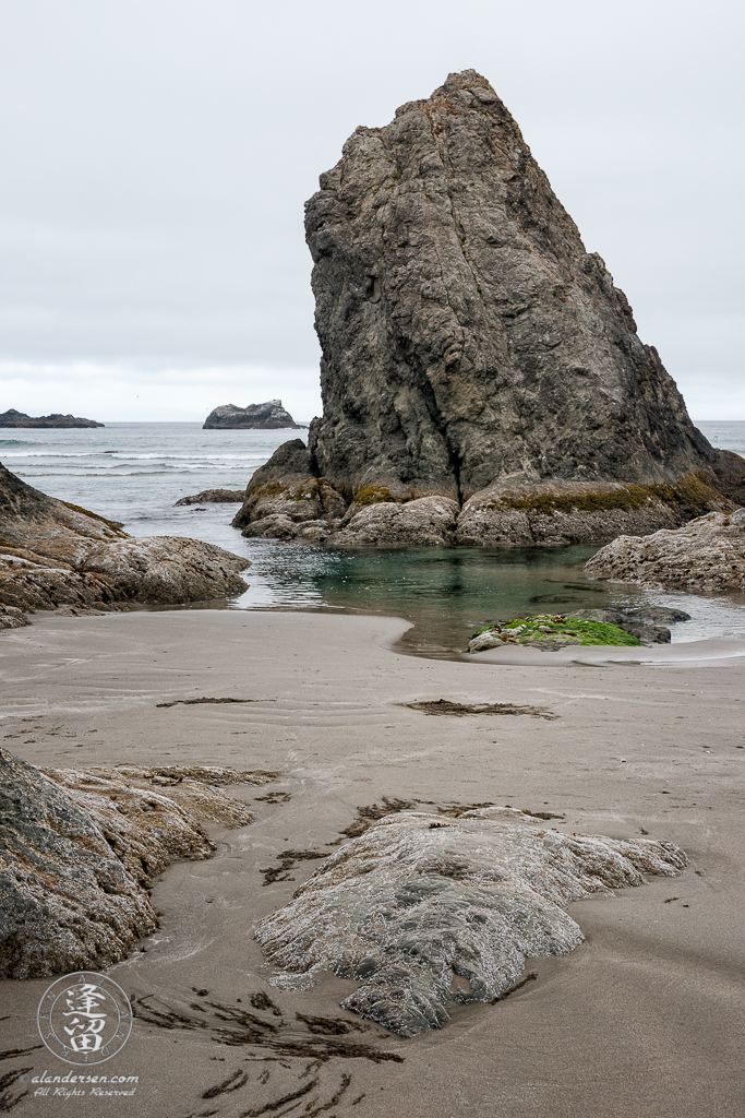 Seastacks and sand on the beach near Coquille Point at Bandon in Oregon.