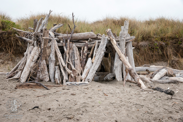 Driftwood beach house constructed on the beach near Bandon South Jetty County Park at Bandon, Oregon.