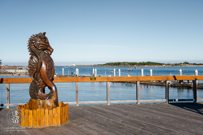 Myrtlewood (Umbellularia californica) sculpture of a seahorse on the boardwalk at Bandon "Old Town" in Oregon.