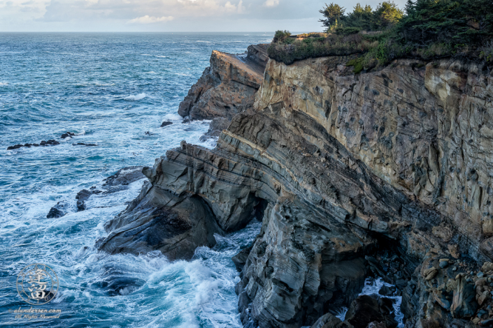 Scenic view of cliffs along trail between Shore Acres State Park and SImpson Reef Overlook, outside of Charleston in Oregon.