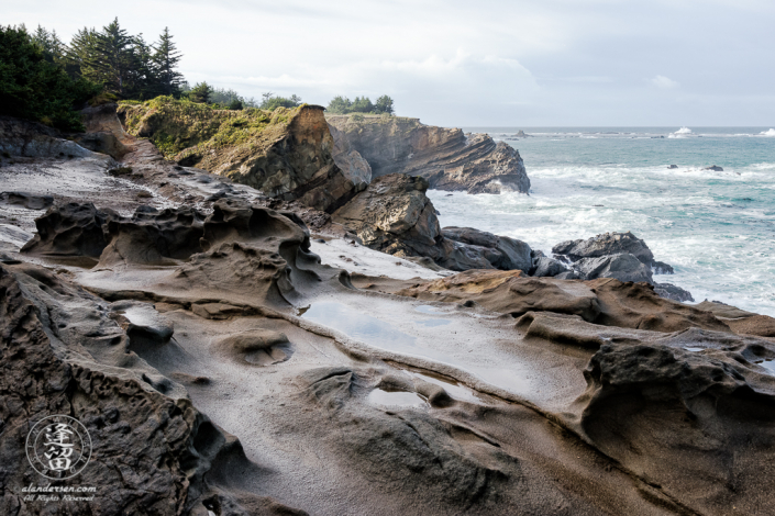 The amazing geology of the rugged cliffs at Shore Acres State Park outside of Charleston in Oregon.