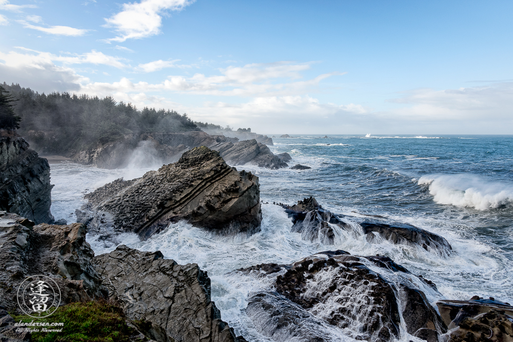 Pacific swells pound the rugged coast at Shore Acres State Park outside of Charleston in Oregon